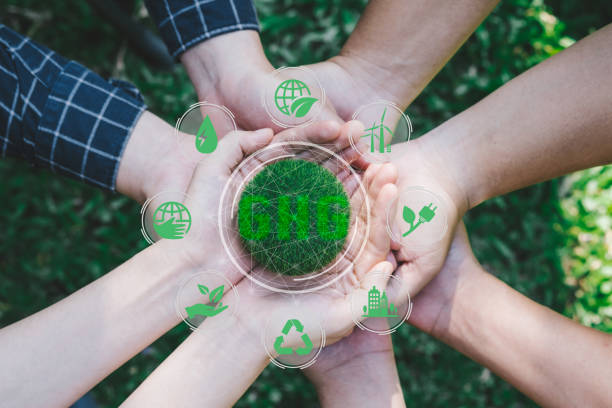 istock Hands adult Teamwork harmony Holding earth on hands with GHG icon concept for environmental, social, and governance in sustainable and ethical business on the Network connection 1398433235