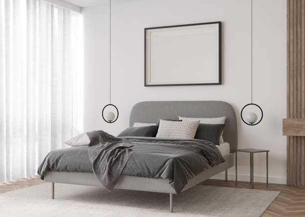 istock Empty picture frame on white wall in modern bedroom. Mock up interior in contemporary style. Free, copy space for your picture, poster. Bed, lamps. 3D rendering. 1398435612