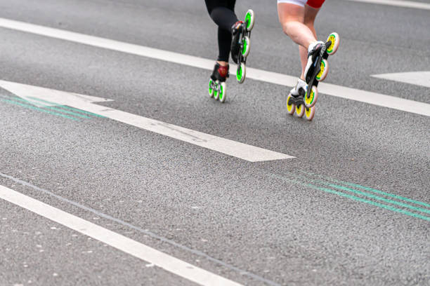 Low Section Of Man Skating On Road
