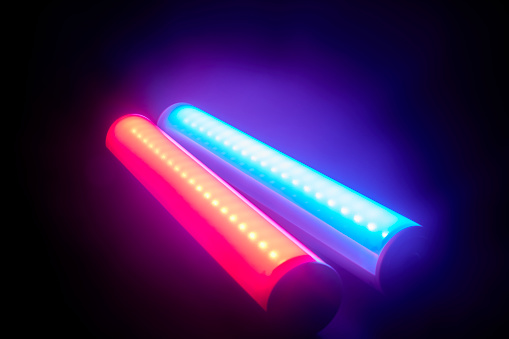 Red and blue led tube lights on a black background