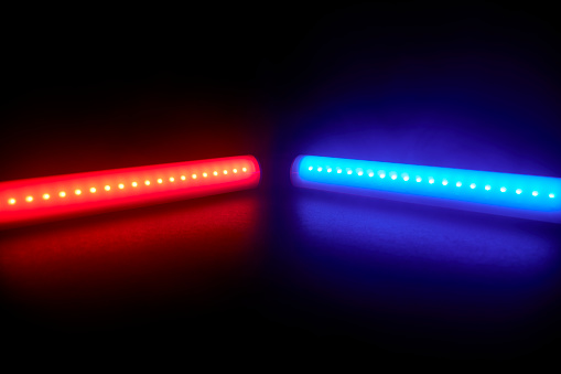 Red and blue led tube lights on a black background
