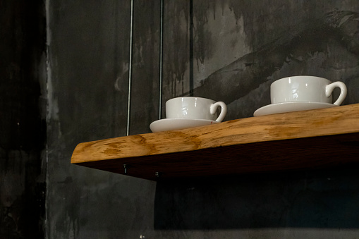 coffee cup on wall shelf