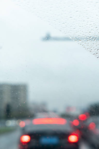 istock Raindrops on car window in rainy day 1398440312