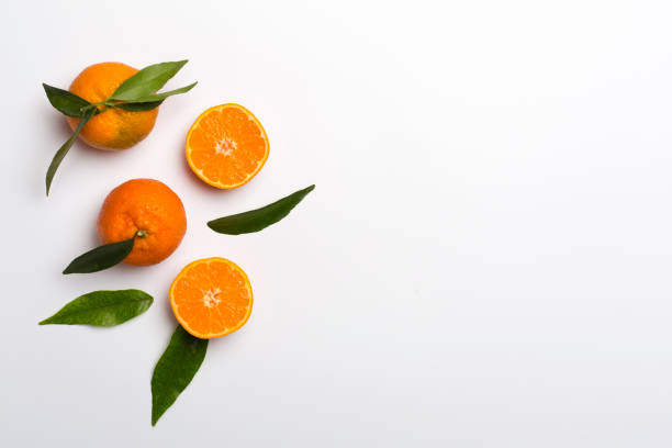 istock Flat lay with fresh mandarines on color background. Top view 1398441419