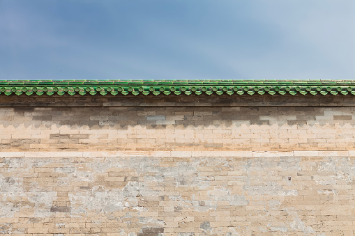 Brick wall with green tiles at Temple of Heaven in Beijing, China