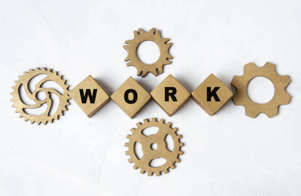 istock Lettering WORK made from toy blocks and cogwheels 1398443501
