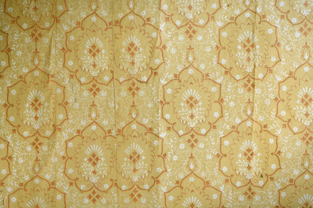 istock Old torn wallpaper on the wall.Old wallpaper for texture or background. 1398443929