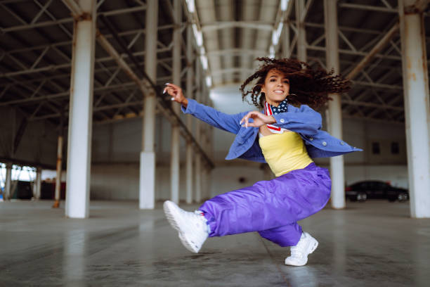 istock Young  woman - dancer dancing  in the underpass. 1398450987