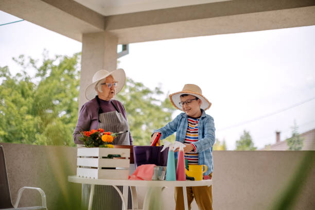istock Multi generation family potting flower 1398454593