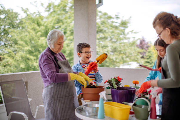 istock Multi generation family potting flower 1398454756