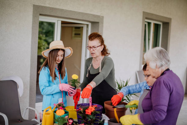 istock Multi generation family potting flower 1398454840