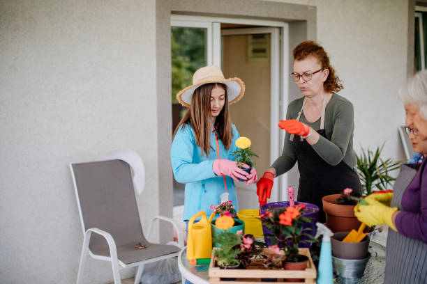 istock Multi generation family potting flower 1398454841