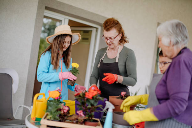 istock Multi generation family potting flower 1398454847