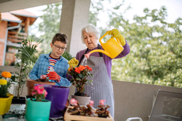 istock Multi generation family potting flower 1398454878