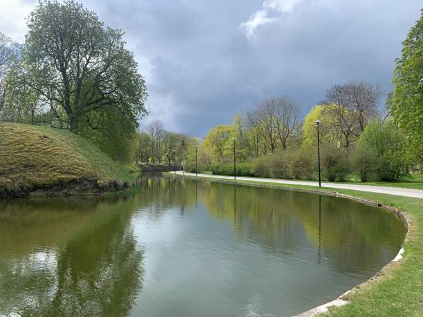 istock Beautiful green park and a river before the rain 1398461718