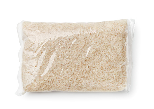 Top view of rice packed in plastic bag isolated on white