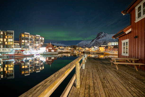 Svolvaer by dusk in Vagan Nordland Lofoten arcipelago  North of Norway . Svolvaer with the Northern lights  in Austvagoya island Vagan Nordland Lofoten archipelago  North of Norway on March 12, 2022. View from the island of Lamholmen, in the middle of Svolvær Harbour. harbor of svolvaer in winter lofoten islands norway stock pictures, royalty-free photos & images