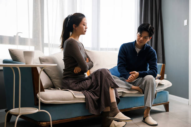 istock young couple ignoring each other after an argument at home 1398473255