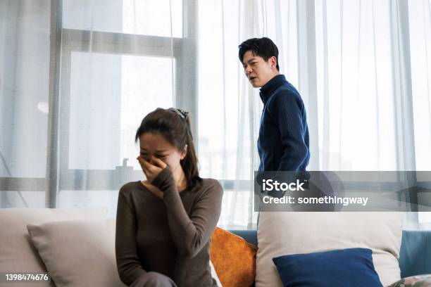 Handsome Man And Beautiful Young Woman Are Having Quarrel Stock Photo - Download Image Now
