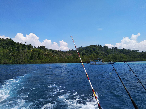 3 trolling fishing rods over the sea - Fishing boat - Indonesia