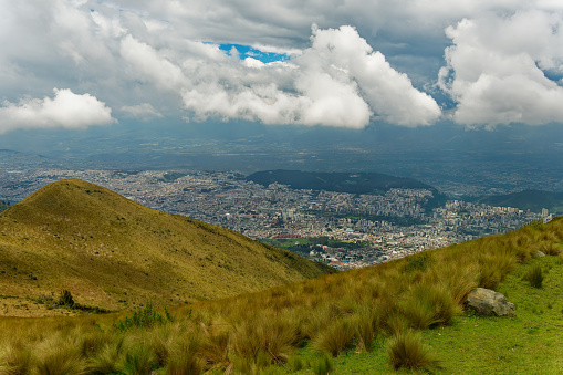 Landscape view to Quito from the peak Pichincha Volcano. High mountains above the city in Ecuador.