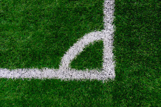 Artificial turf soccer field with corner marker line. Artificial turf soccer field with corner marker line. artifical grass stock pictures, royalty-free photos & images