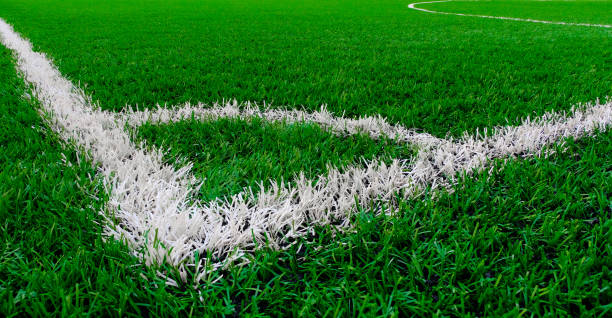 Artificial turf soccer field with corner marker line. Artificial turf soccer field with corner marker line. artifical grass stock pictures, royalty-free photos & images