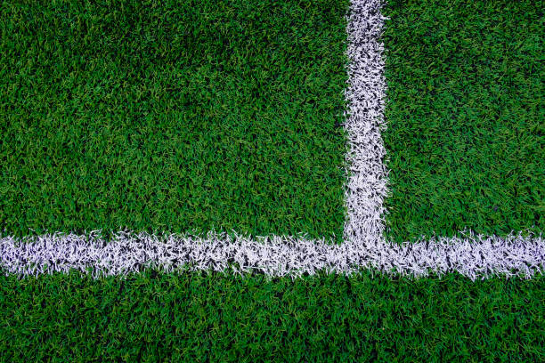 Artificial turf soccer field with marker line. Artificial turf soccer field with marker line. artifical grass stock pictures, royalty-free photos & images