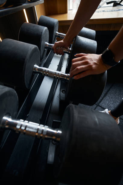istock Professional bodybuilder choosing fitness equipment for strength training 1398486252