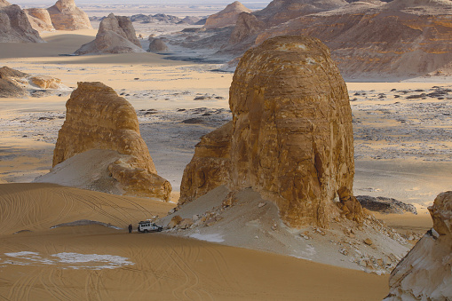 Adventure 4x4 Car among Beautiful Sand Formations in the White Desert Protected Area, is National Park in the Farafra Oasis, Egypt