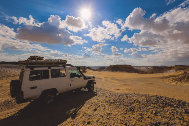 istock Adventure 4x4 Car among Beautiful Sand Formations in the White Desert Protected Area 1398487748