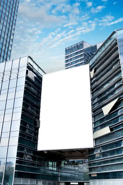 Photo of Blank billboard on modern building wall