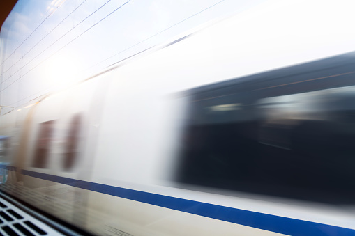 High speed train driving on railroad track.