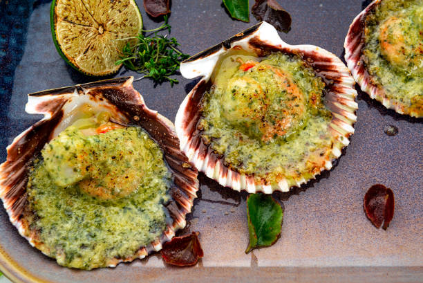 istock Scallops baked in a shell with cheese and pesto sauce 1398490832