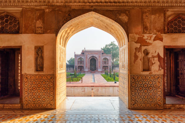 istock Scenic view of red sandstone building through arched gate, India 1398493290