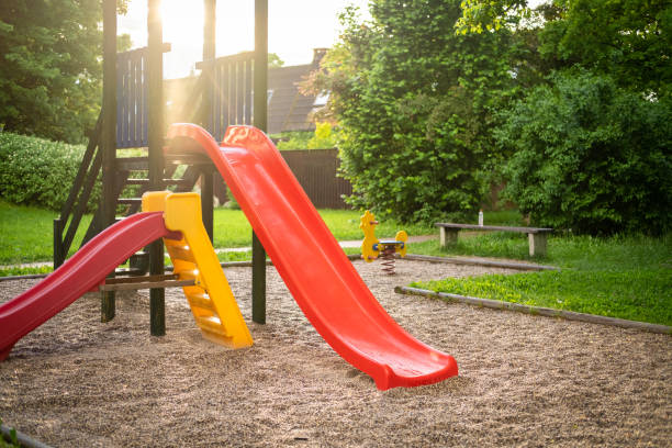 istock Sun illuminates children's playground in the park. 1398493326