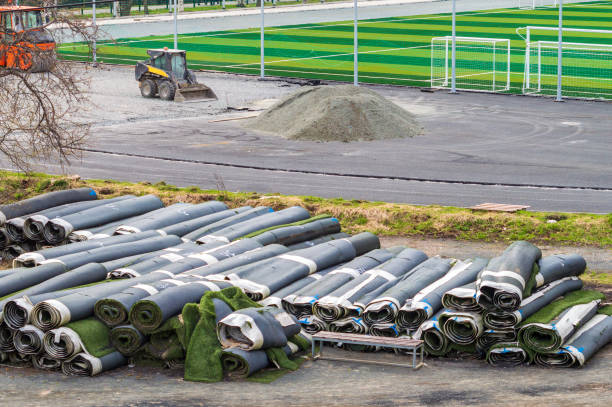 artificial rolled green grass near stadium