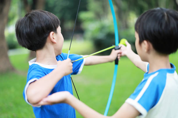A bow with an arrow built with foreign elements, the bow of a car windshield wiper and the arrow of a kitchen skewer.