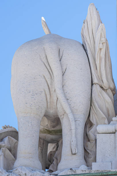 istock statue in white stone back of elephant. 1398500016