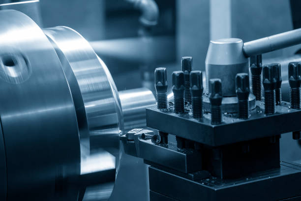istock The lathe machine finish cutting the brass disk parts by lathe tools. 1398505100