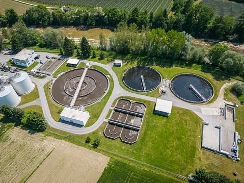 Waste water treatment plant in the country side of Slovenia. Aerial view of cleaning the environment, purification and filtration of sewage water.