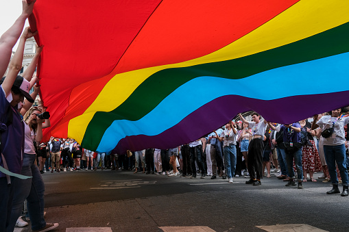 People carry a large rainbow flag at the 'Belgian Pride', a manifestation of lesbian, gay, bisexual and transgender oriented people  in Brussels, Belgium on May 21, 2022.