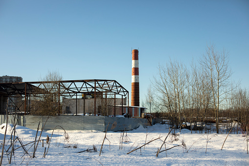 Industrial type. Landscape with trumpet. Industrial zone in winter. Production unit in rural areas.