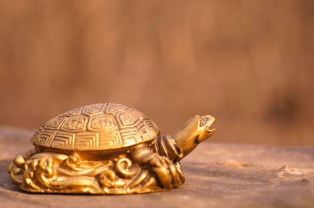 istock Metal turtle on a bright background. 1398511890