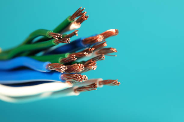 istock Electrical wires on light blue background, closeup. Space for text 1398514273