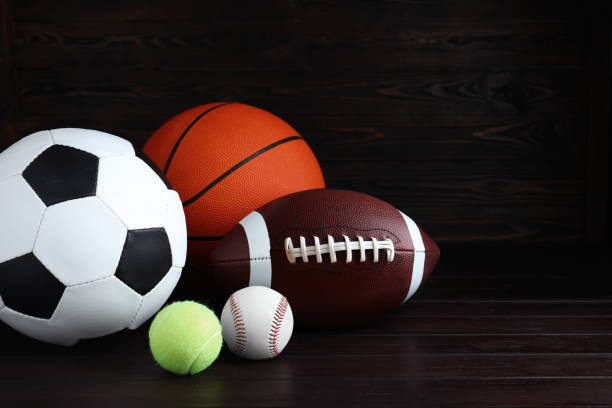 istock Set of different sport balls on wooden table. Space for text 1398515644