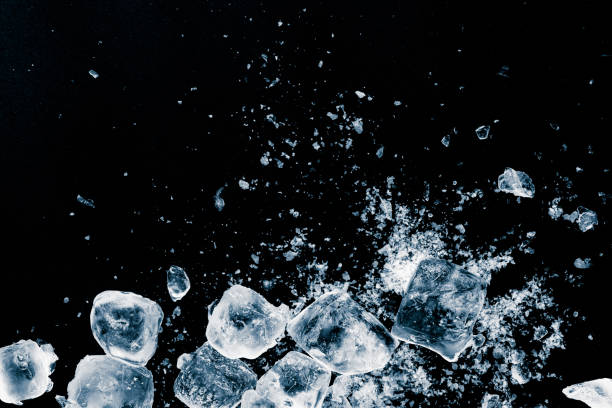 istock Ice cubes crush on black background. Chill backdrop. 1398515703