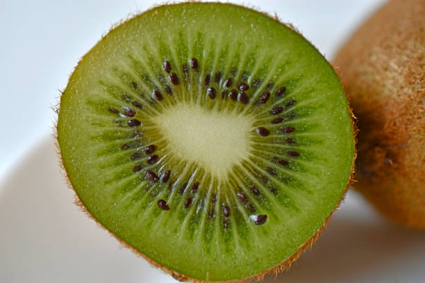 istock Half a green kiwi fruit on a plate 1398517480