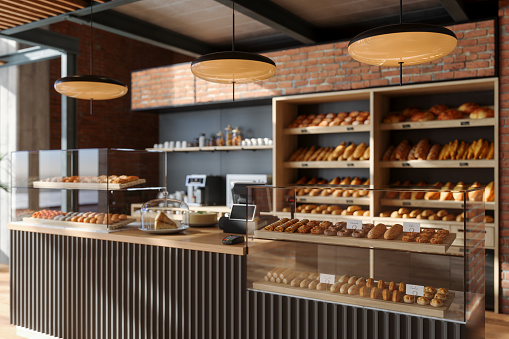 Interior de la panadería. Vista de cerca del mostrador de panadería con comida recién horneada y bollos. photo