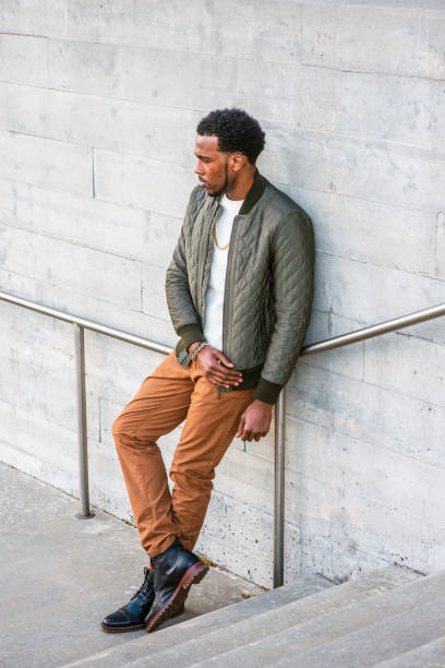 istock Young black man standing outdoors by wall in New York City 1398519749
